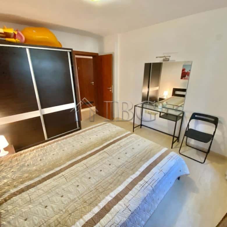 Bright bedroom with modern furnishings and ample space.