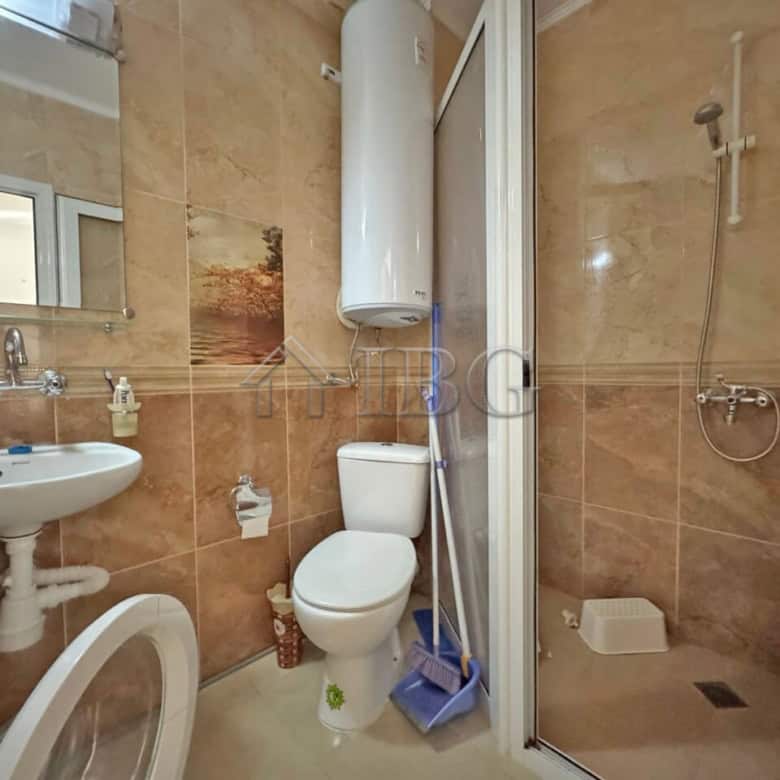 Bright studio bathroom with shower and modern fixtures in Magnolia Residence 2, Sunny Beach.
