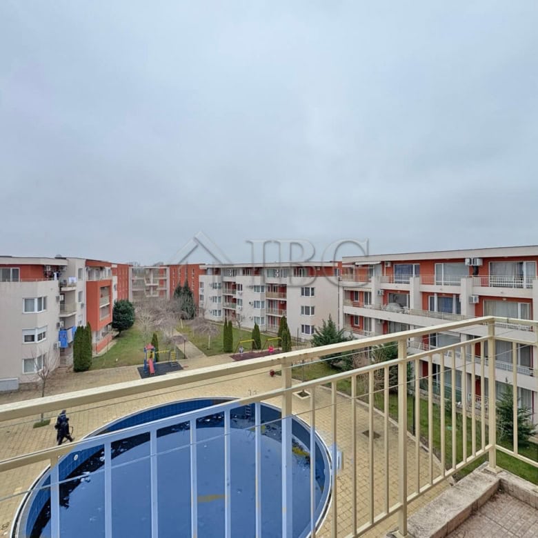 Bright view of the pool from a Sunny Beach apartment balcony.