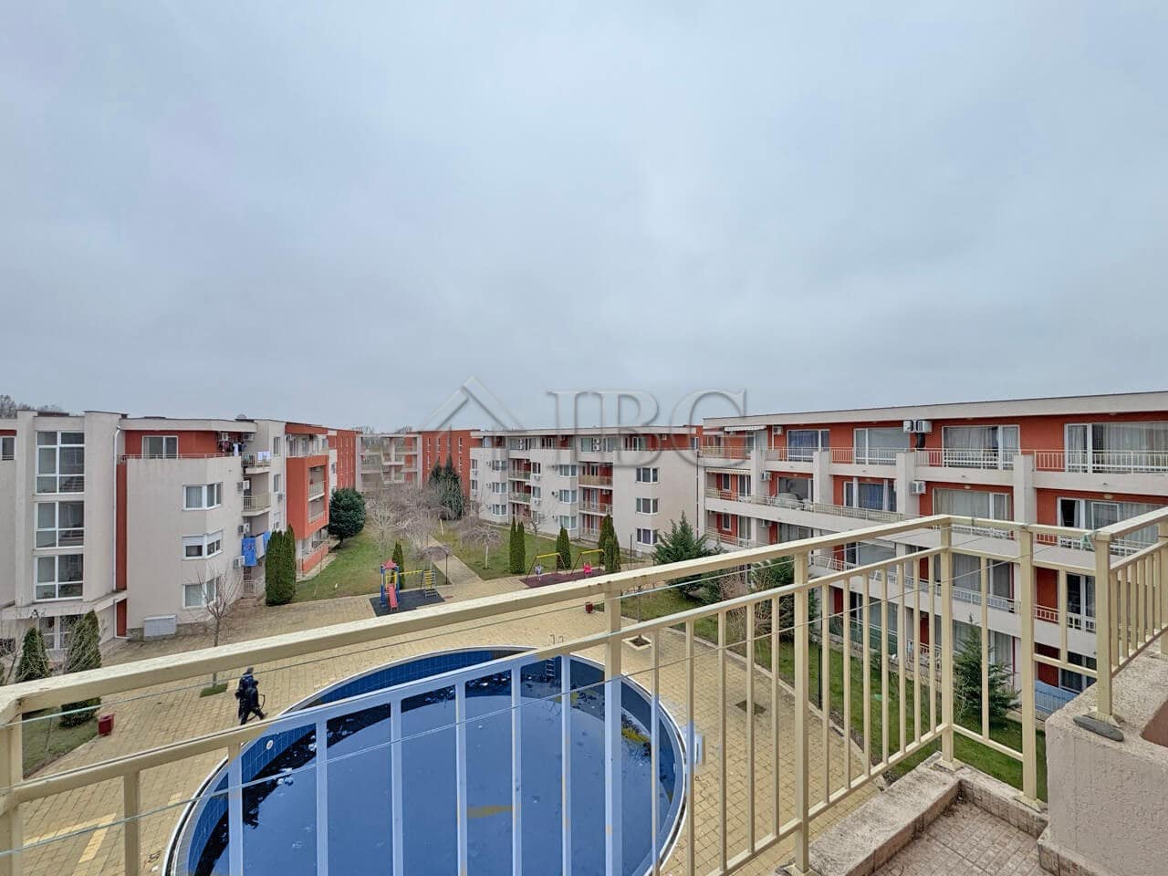 Bright view of the pool from a Sunny Beach apartment balcony.