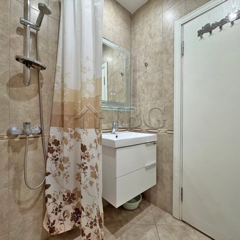 Cozy bathroom with shower in a seaside studio apartment near Sveti Vlas.