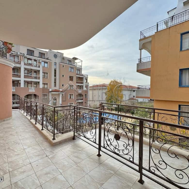 Balcony overlooking the pool at Sveti Vlas apartment in Dinevi Resort. Modern design with spacious o.