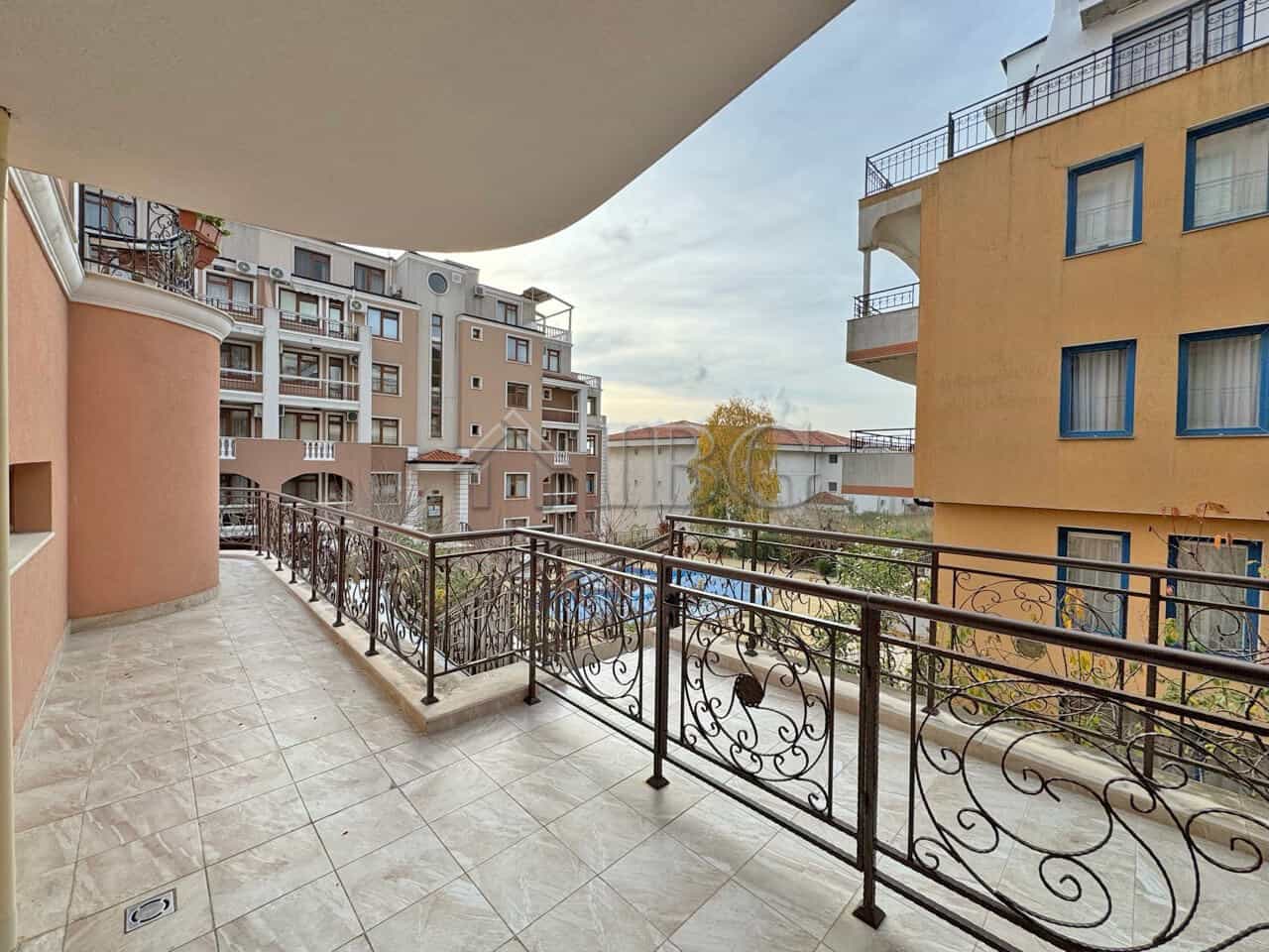 Balcony overlooking the pool at Sveti Vlas apartment in Dinevi Resort. Modern design with spacious o.