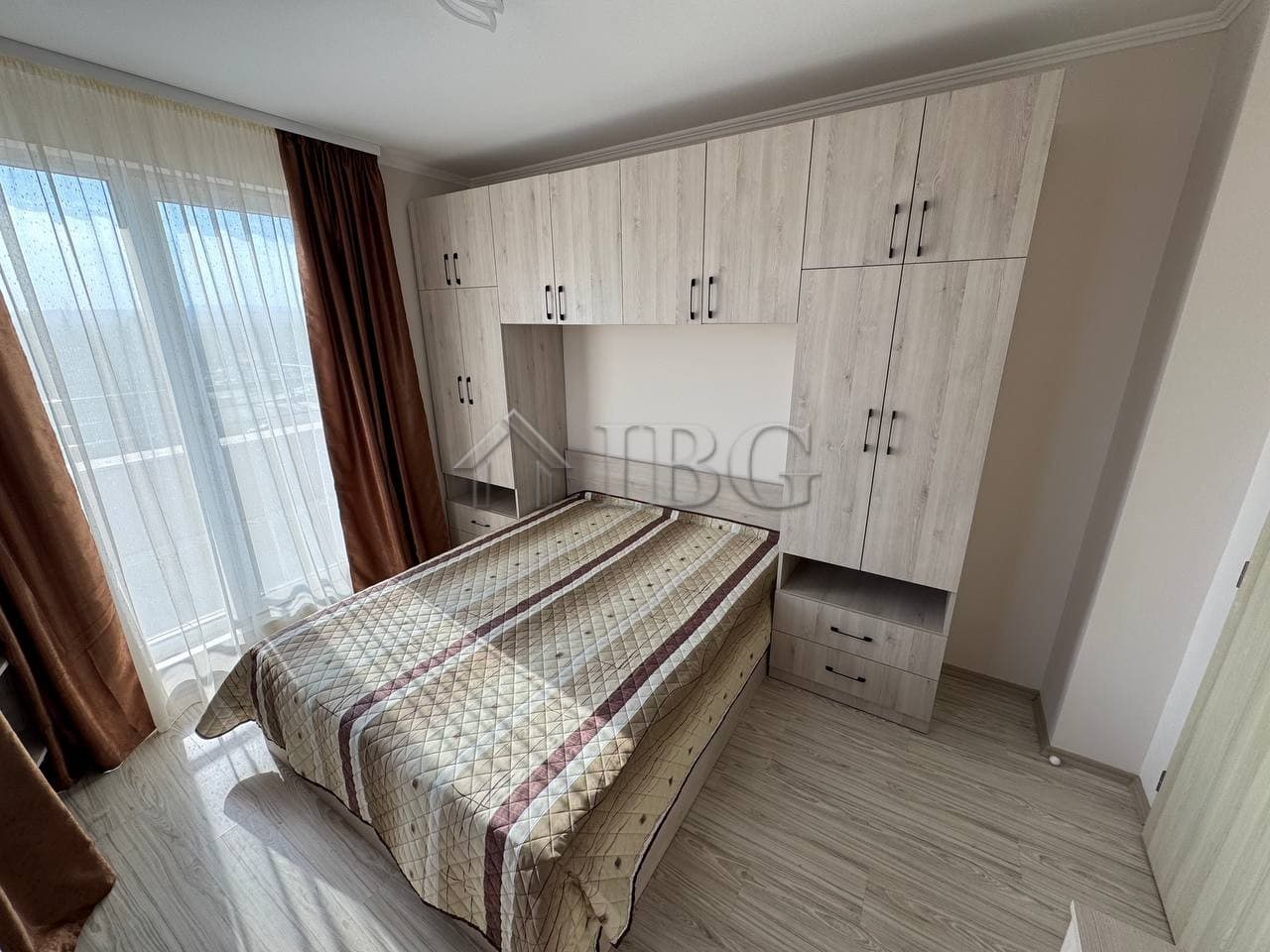 Bright bedroom with custom wardrobe and natural light in Sunny Beach property.