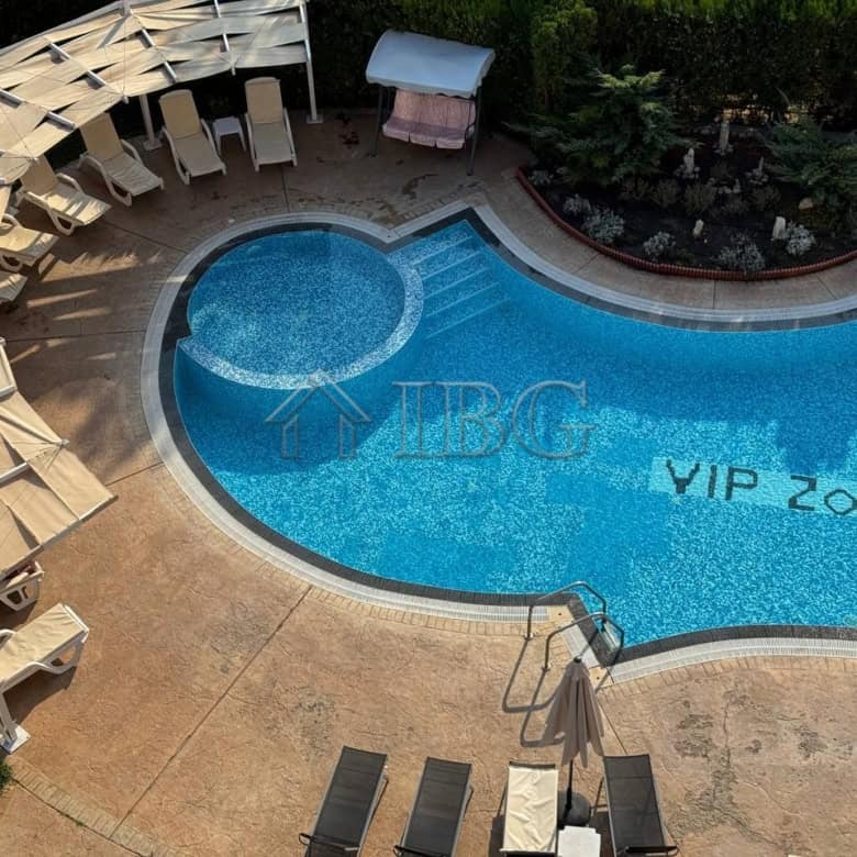 Luxurious pool area at VIP Zone Complex in Sunny Beach, featuring a spacious outdoor pool with sun l.