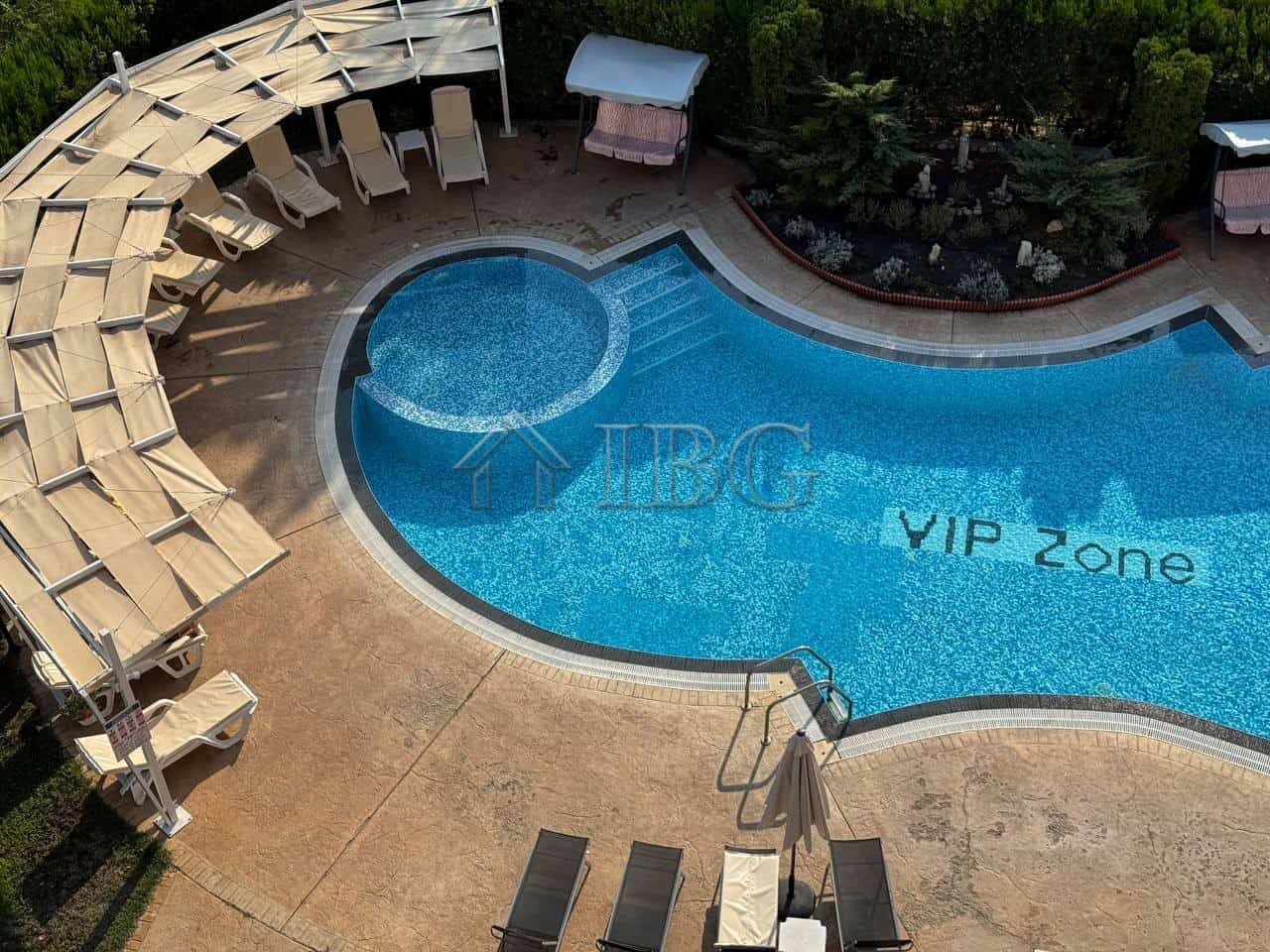 Luxurious pool area at VIP Zone Complex in Sunny Beach, featuring a spacious outdoor pool with sun l.