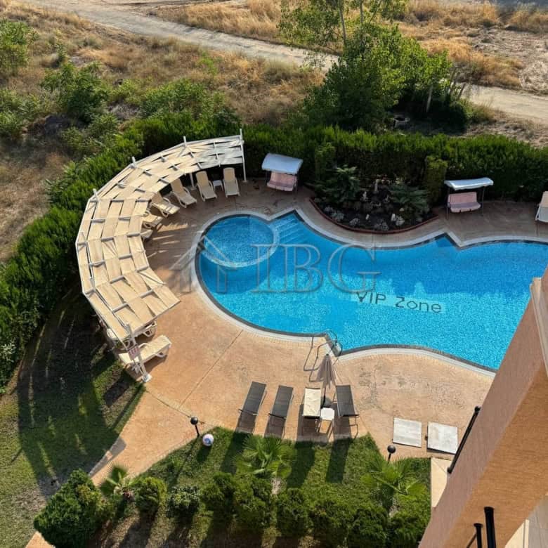 Pool view of a maisonette apartment in Sunny Beach, Bulgaria, with a private pool and surrounding lo.