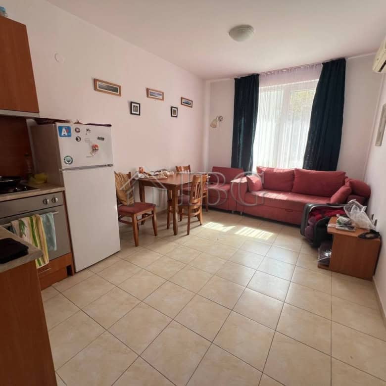 Bright living room with sofa and dining area in Sunny Day 3, Sunny Beach.