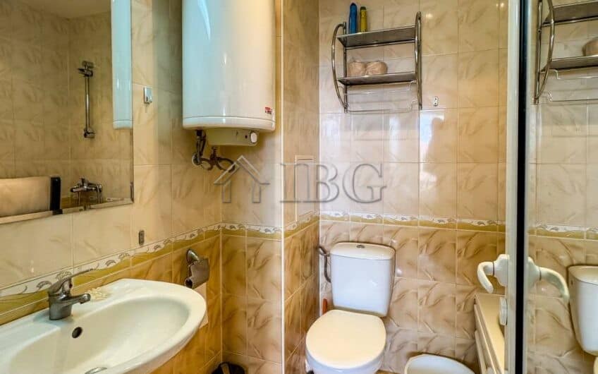 Bathroom with sink, toilet, and water heater in Sveti Vlas apartment.