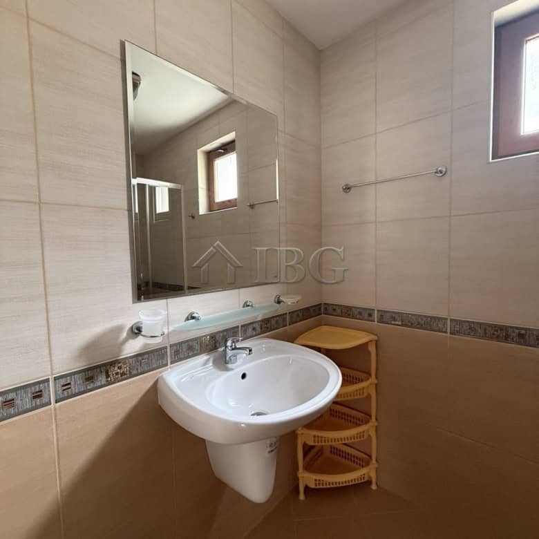 Bathroom with sink and mirror in Tili Complex, Aurelia District, Nessebar.