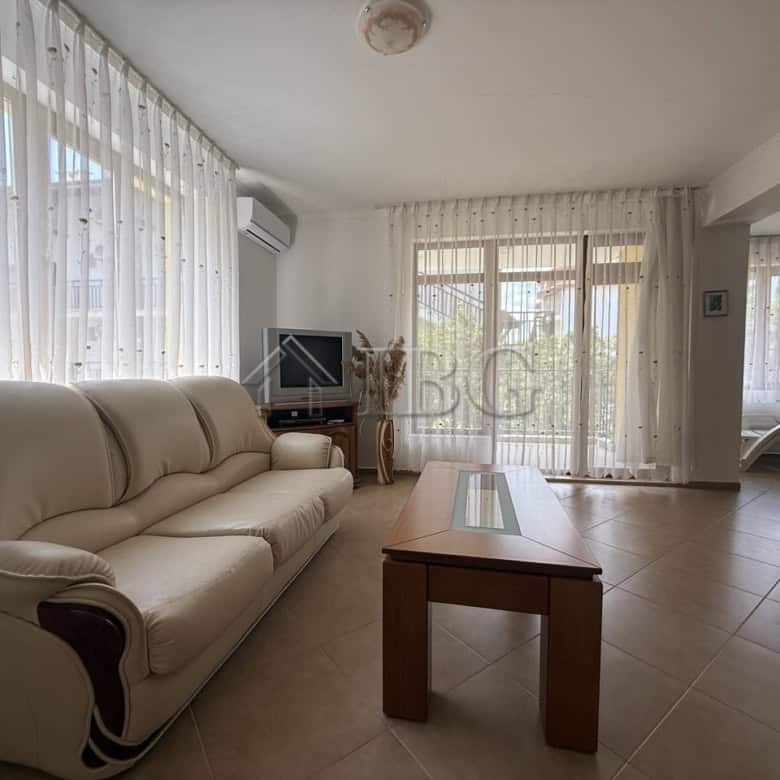 Bright living room with large windows and sheer curtains in Tili Complex, Aurelia District, Nessebar.