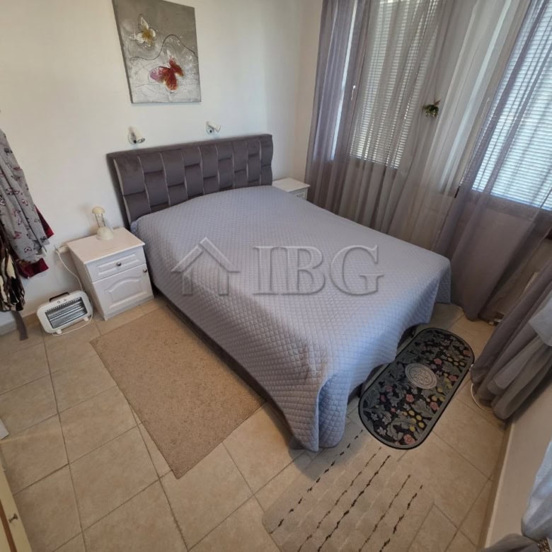 Comfortable bedroom with modern decor and natural light in Ravda.
