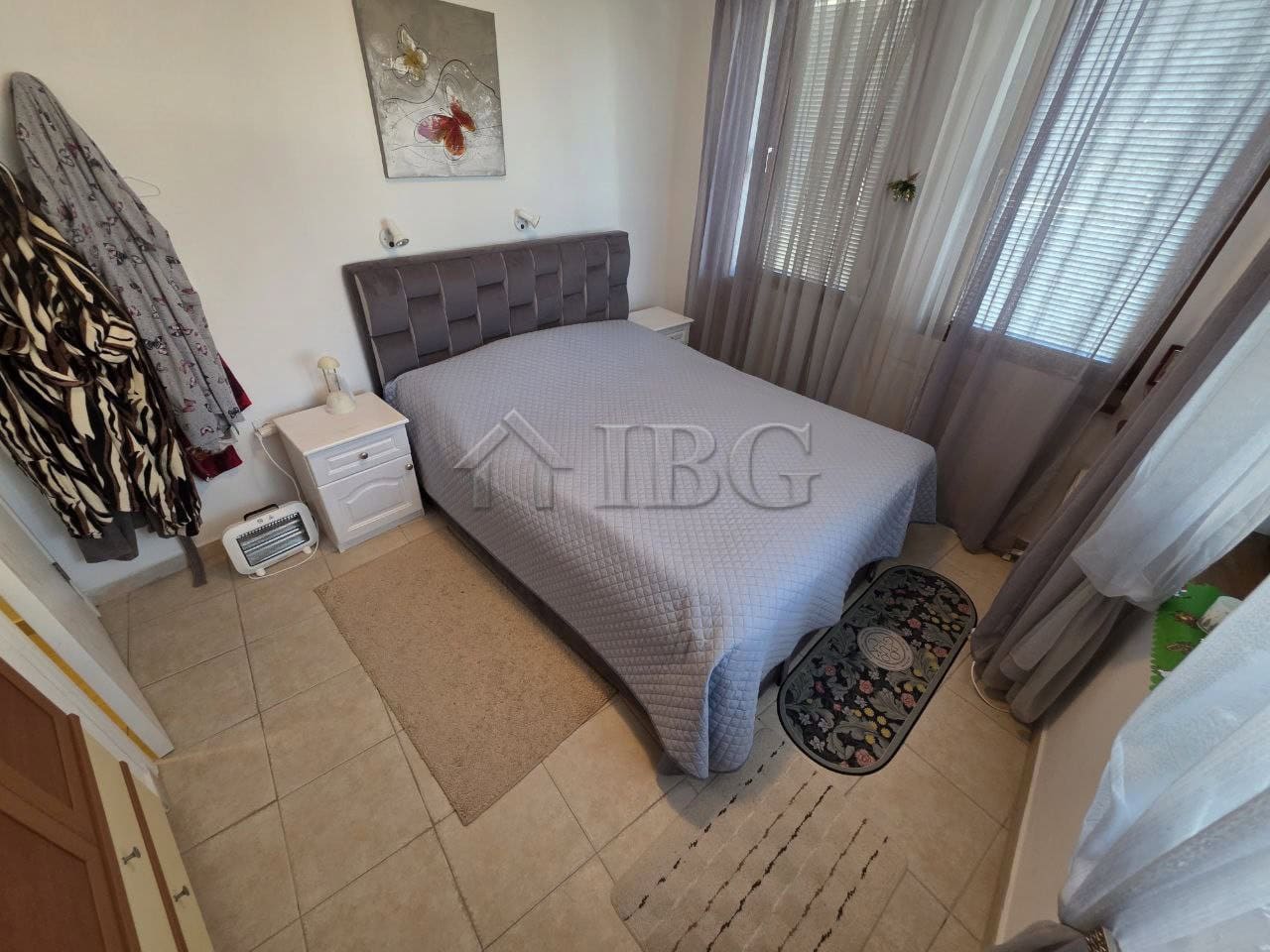 Comfortable bedroom with modern decor and natural light in Ravda.