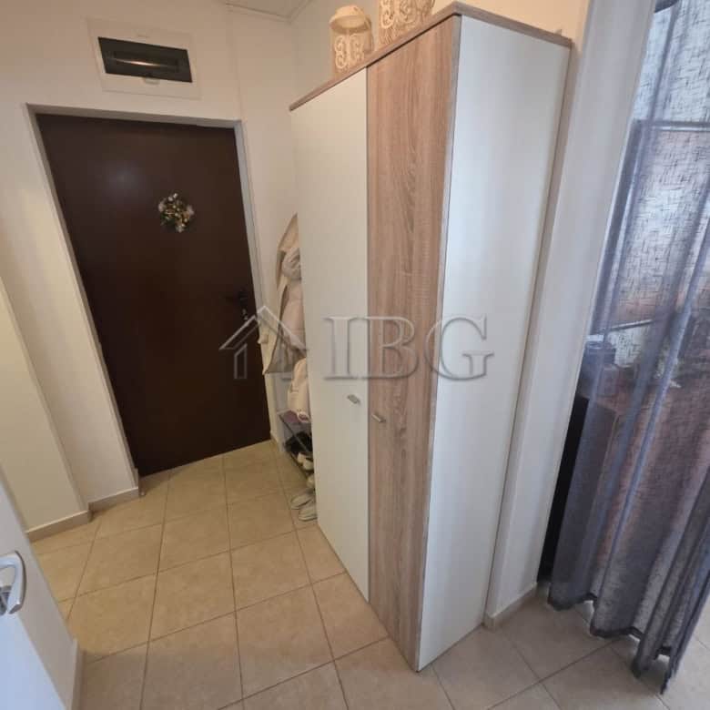 Bright interior with wardrobe and entrance area in Ravda apartment.