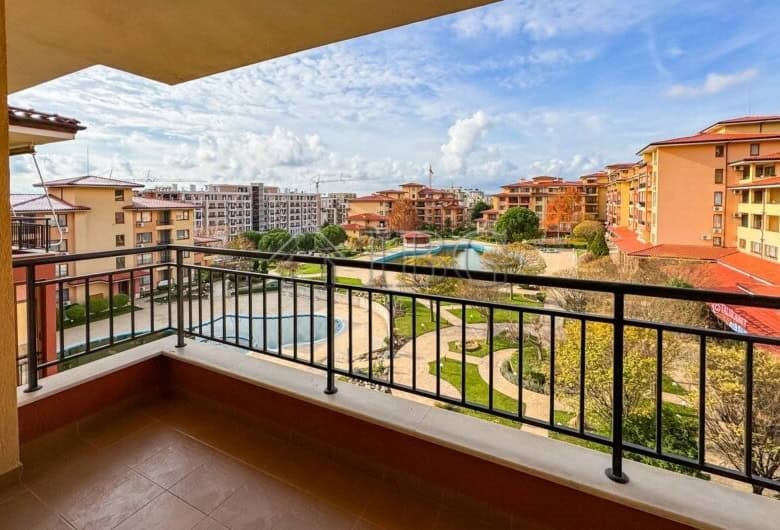 Balcony view of colorful Sveti Vlas buildings, close to the beach, ideal for vacation or investment.