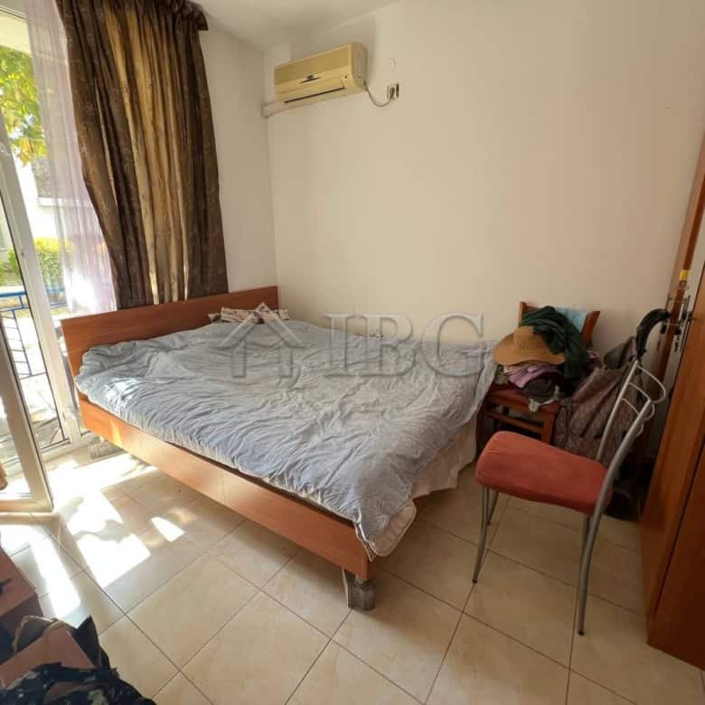 Interior view of a 2-bedroom apartment in Sunny Day 3, Sunny Beach, with sunlight, bed, and balcony.