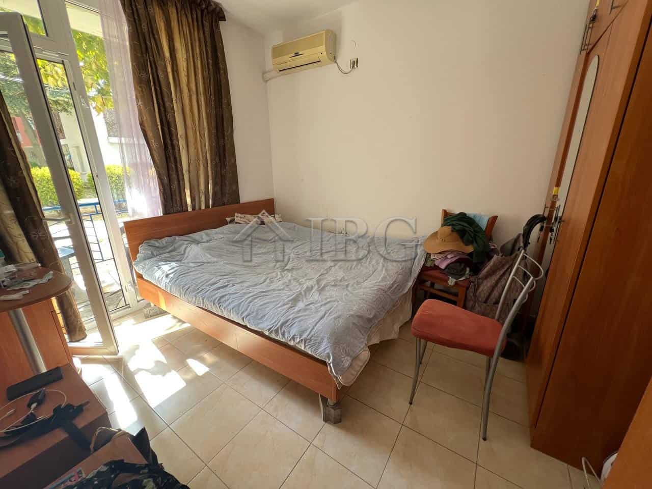 Interior view of a 2-bedroom apartment in Sunny Day 3, Sunny Beach, with sunlight, bed, and balcony.
