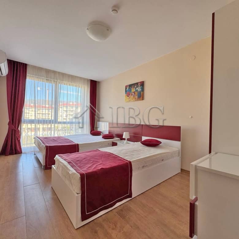 Apartment with sea view in Sveti Vlas, Bulgaria, featuring modern furnishings and balcony access.