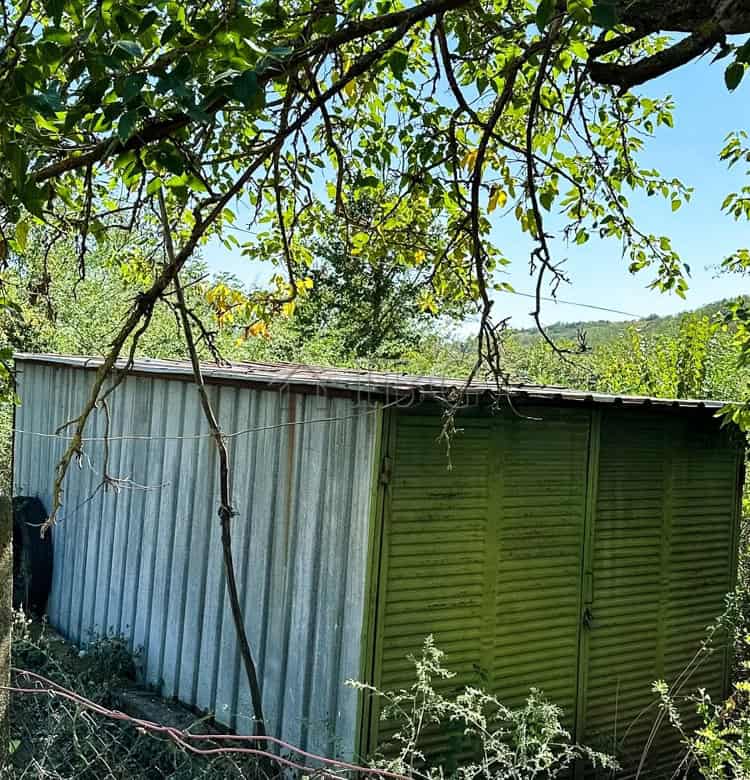 Small renovated one-storey house with garden, outbuildings, and garage. Ready to move in.