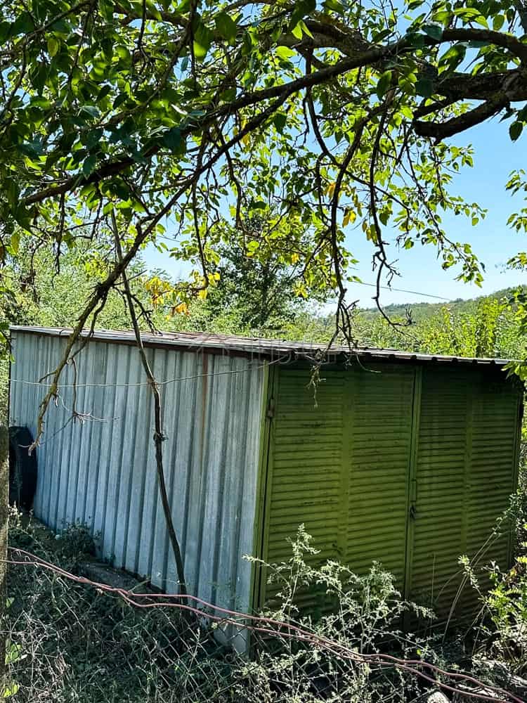 Small renovated one-storey house with garden, outbuildings, and garage. Ready to move in.