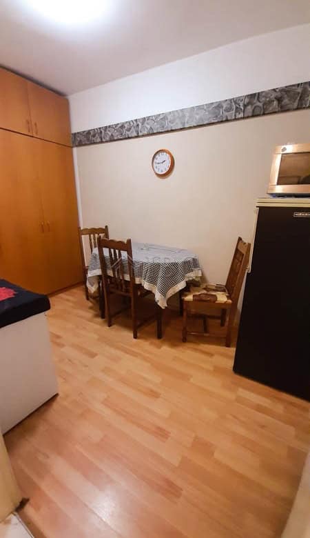 Small dining area with table and chairs in Drujba 2 apartment, Ruse city.