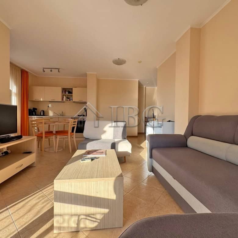 Modern living room in Sunny Beach apartment with stylish furniture and natural light.