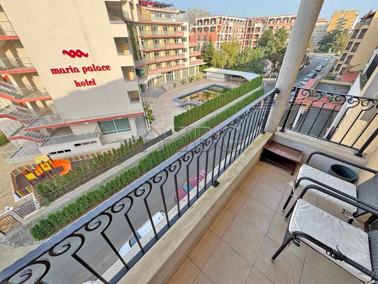 Balcony view of the Royal Sun hotel with outdoor seating and scenic surroundings in Sunny Beach.