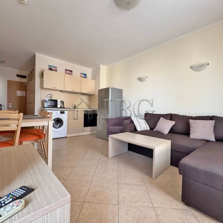 Modern 1-bedroom apartment with living area and kitchenette in Sunny Beach.