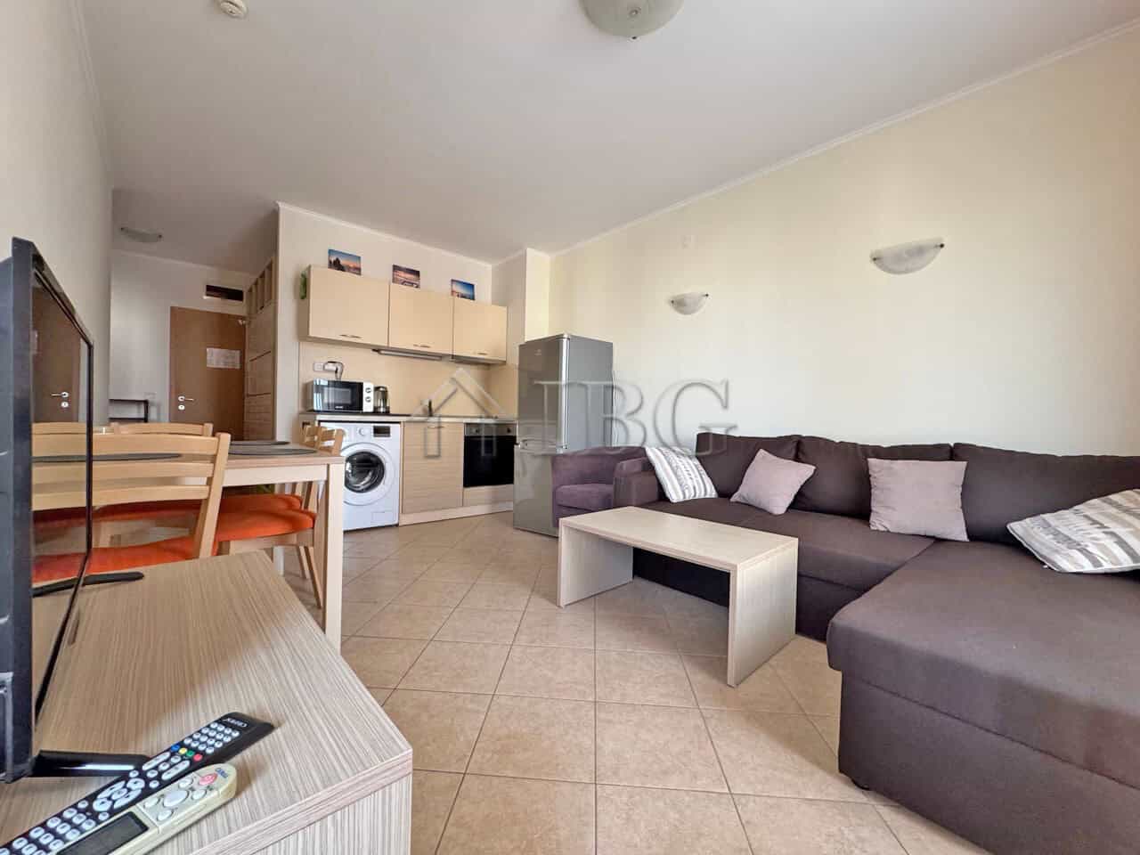 Modern 1-bedroom apartment with living area and kitchenette in Sunny Beach.