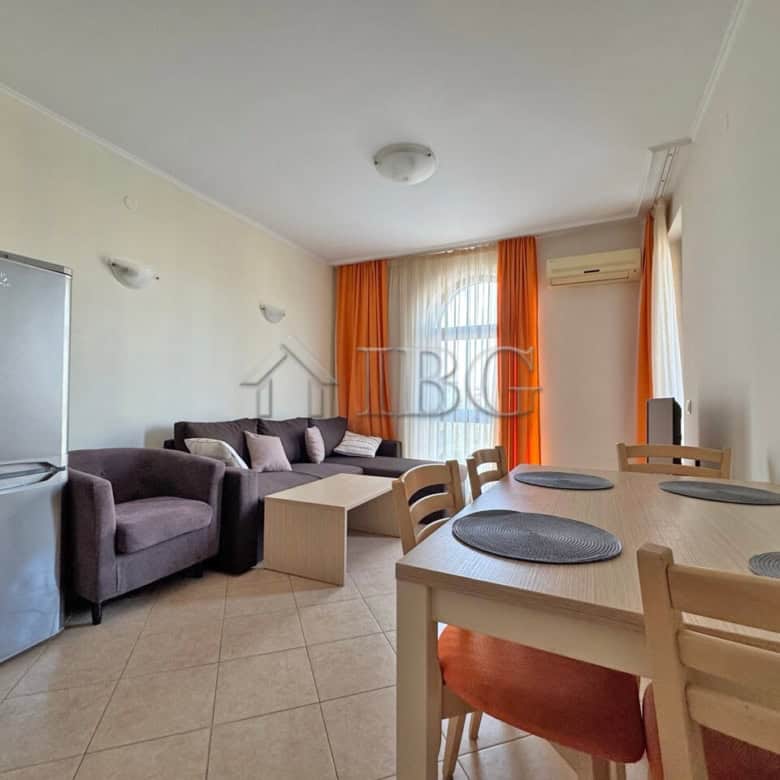 Bright 1-bedroom apartment with living area, dining space, and balcony in Sunny Beach.