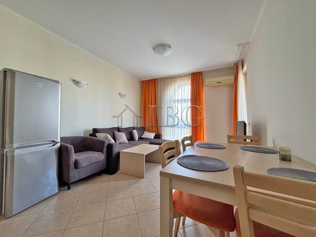 Bright 1-bedroom apartment with living area, dining space, and balcony in Sunny Beach.