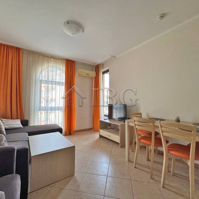Bright 1-bedroom apartment with living area, dining space, and balcony in Sunny Beach.