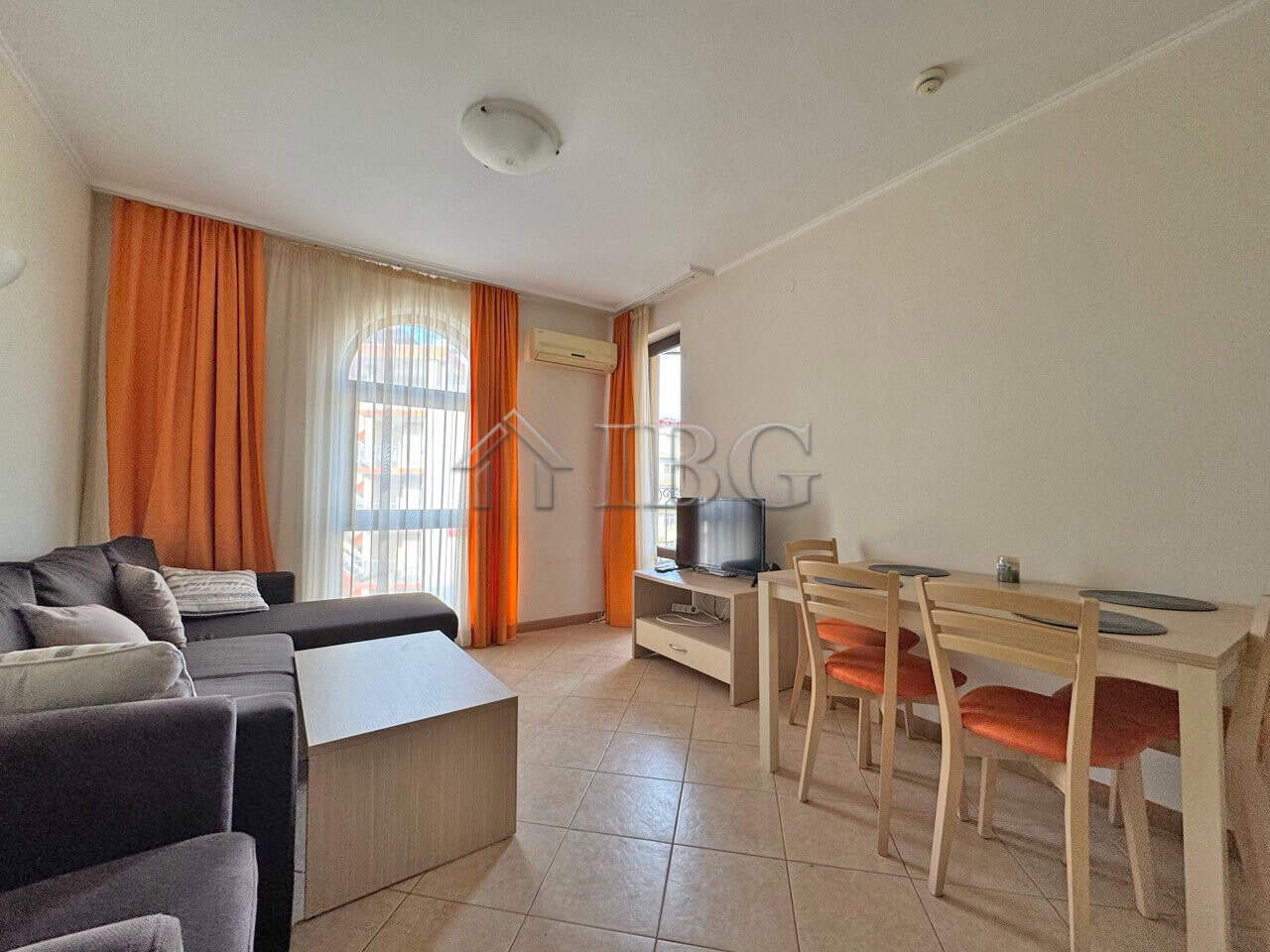 Bright 1-bedroom apartment with living area, dining space, and balcony in Sunny Beach.