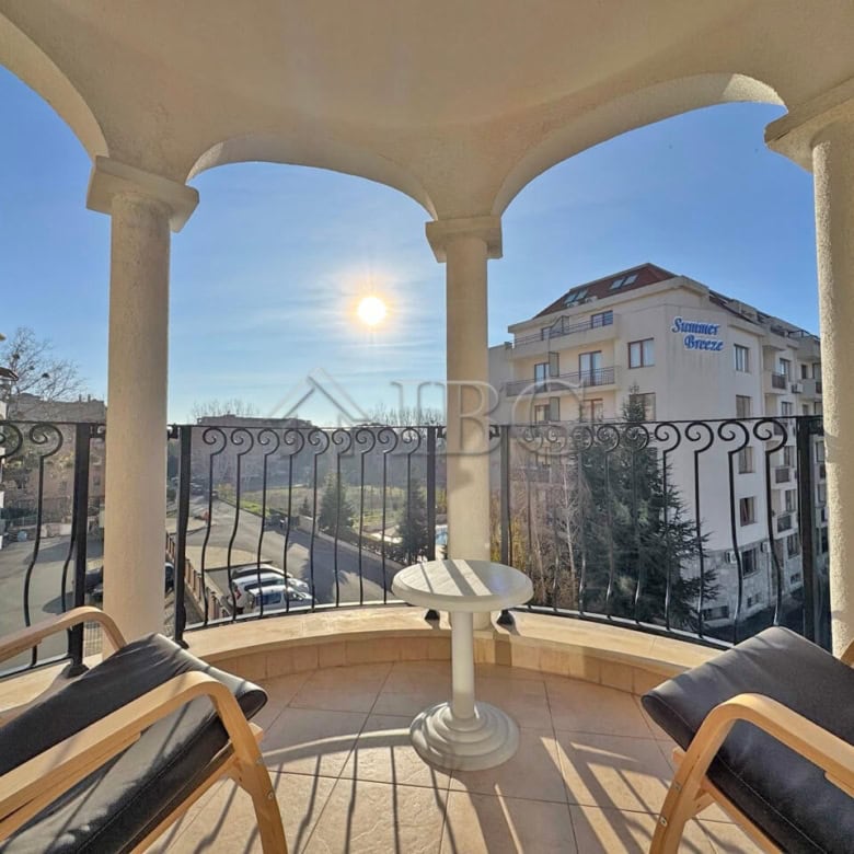 Balcony view of Sunny Beach with cityscape and clear sky.