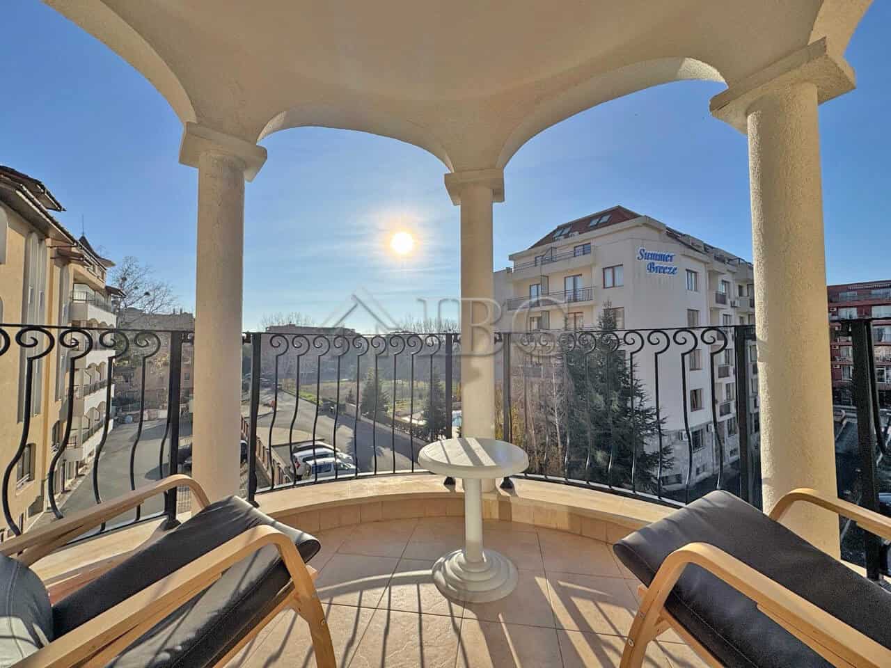 Balcony view of Sunny Beach with cityscape and clear sky.