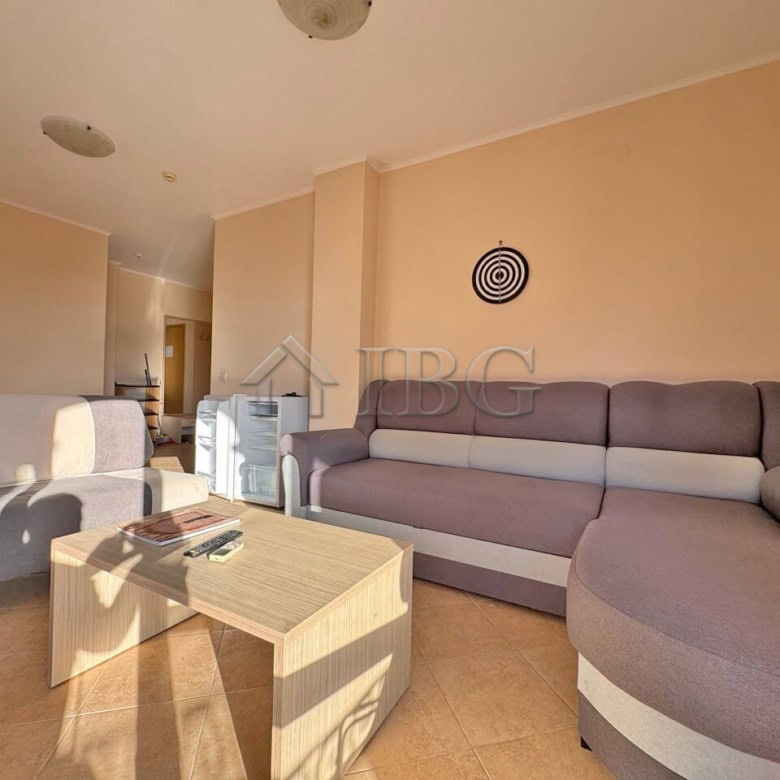 Spacious living area with comfortable sofas and natural sunlight in the Royal Sun Complex, Sunny Bea.