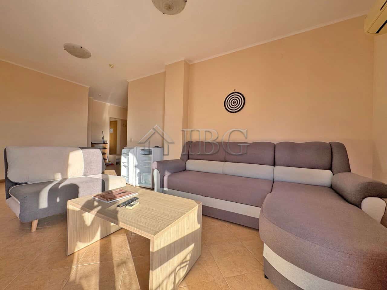 Spacious living area with comfortable sofas and natural sunlight in the Royal Sun Complex, Sunny Bea.