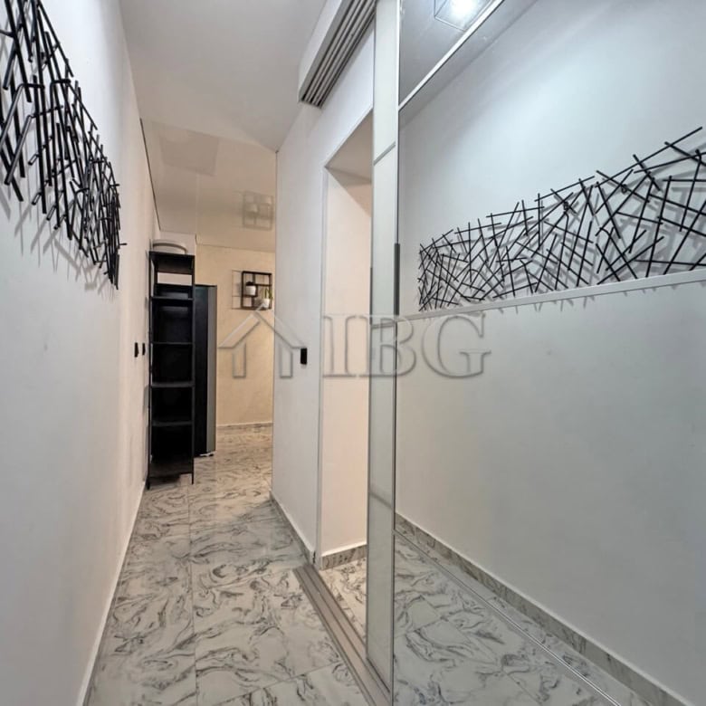 Interior view of a modern 3-room apartment with a large terrace in Sunny Beach.