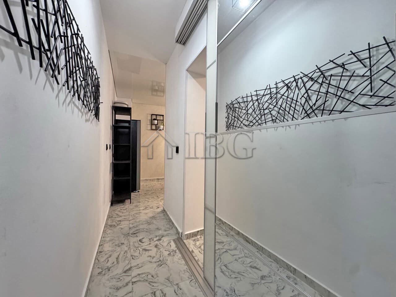 Interior view of a modern 3-room apartment with a large terrace in Sunny Beach.