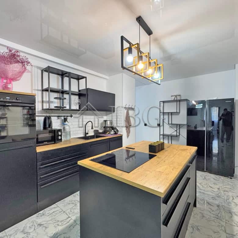 Modern three-room apartment with large terrace in Sunny Beach. Stylish kitchen, contemporary decor,.