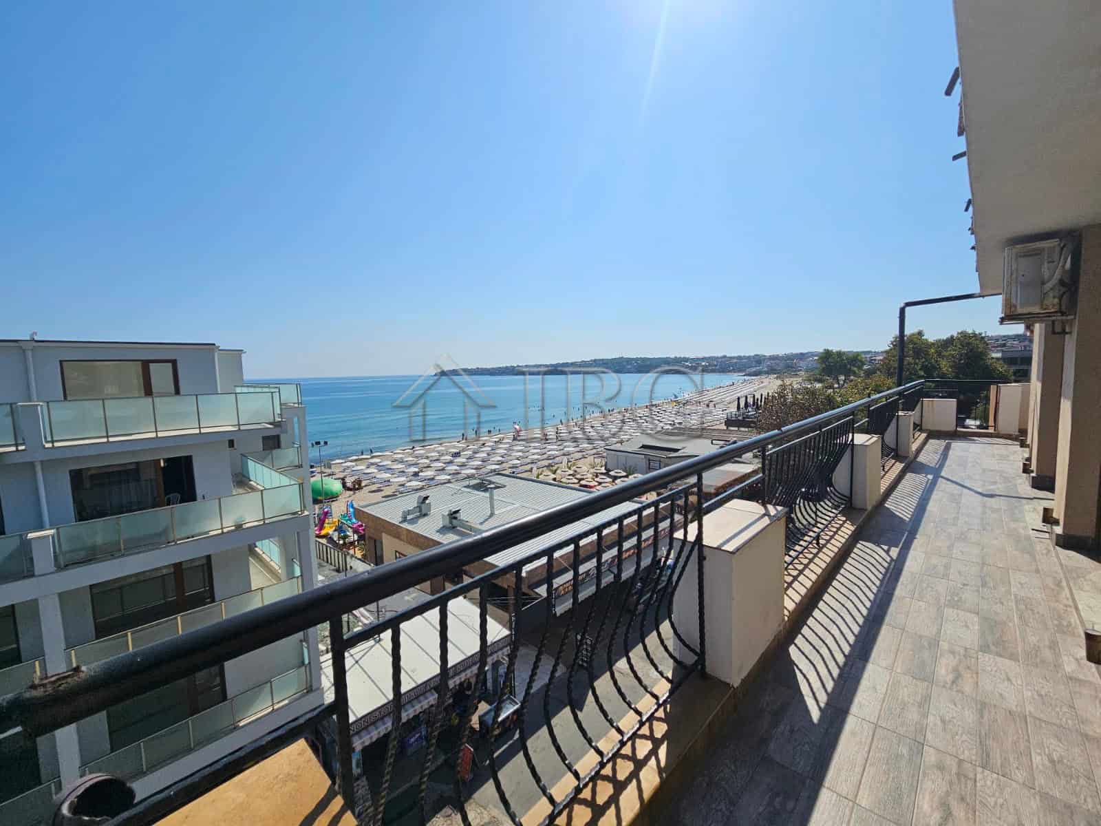 Sea view balcony overlooking Sozopol beach and coastline.