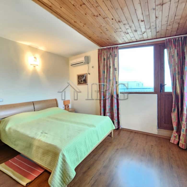 Bright bedroom with sea view in Sozopol apartment, featuring 2 bedrooms and 2 bathrooms, perfect for.