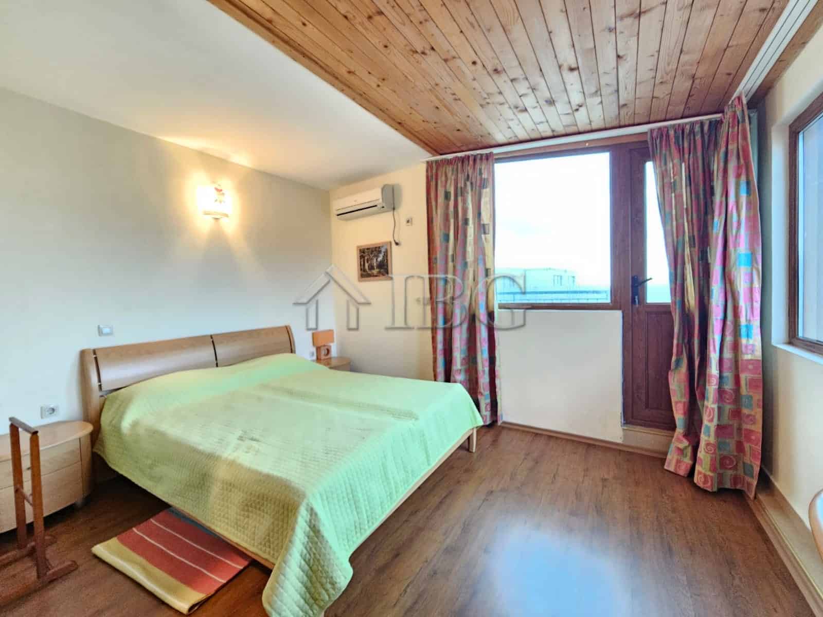 Bright bedroom with sea view in Sozopol apartment, featuring 2 bedrooms and 2 bathrooms, perfect for.