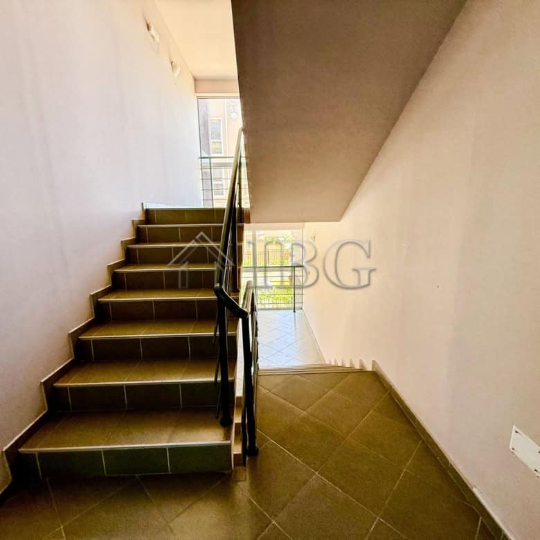 Interior view of a storage studio in Summer Ravda, showing stairs and utility access points.