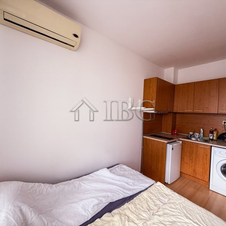 Cozy studio apartment in Sunny Beach featuring a compact kitchen and essential appliances.
