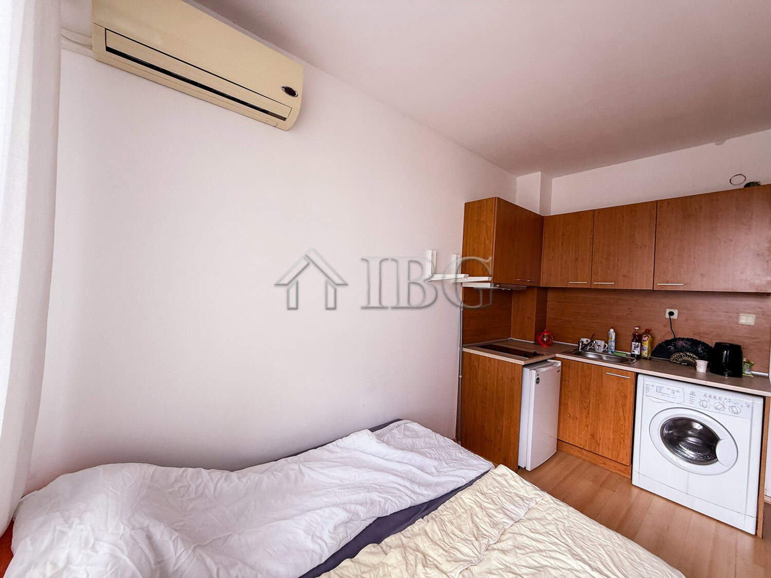 Cozy studio apartment in Sunny Beach featuring a compact kitchen and essential appliances.