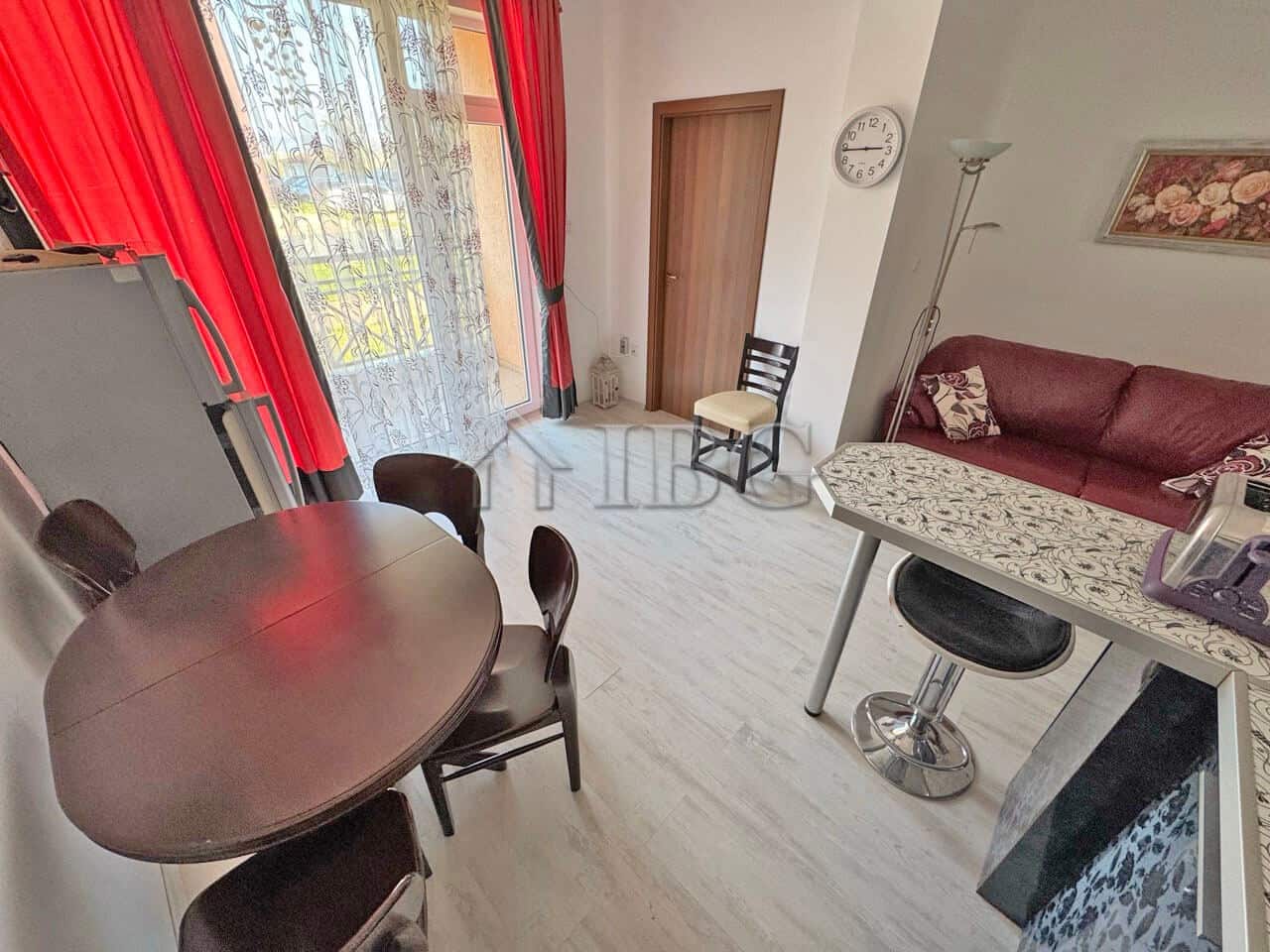 Interior view of a ground-floor apartment with living room, dining area, and balcony in Sunny Beach.
