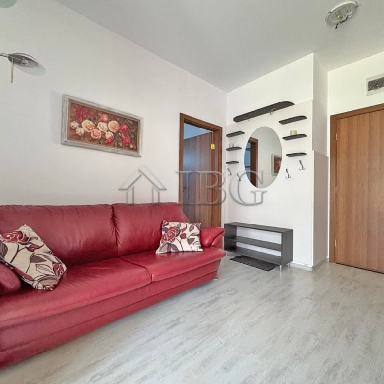 Bright living room with red sofa and modern decor in Sunny Day 6, Sunny Beach.