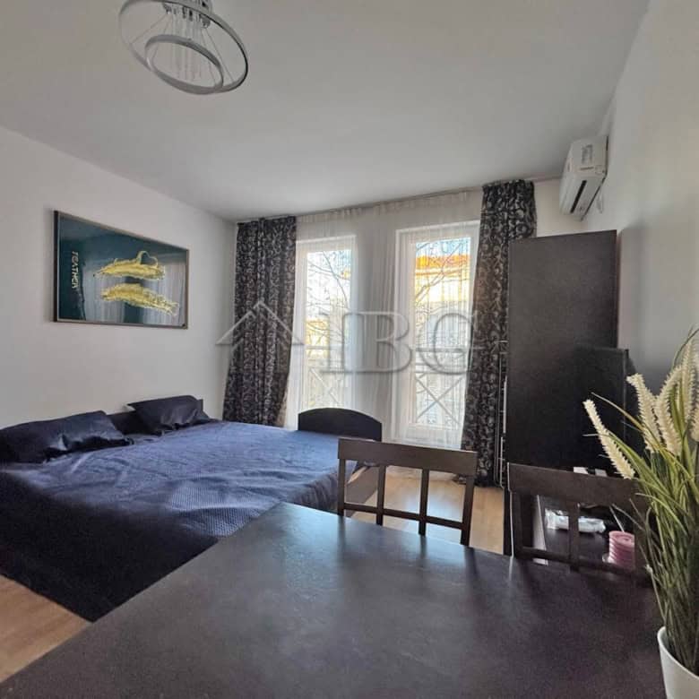 Bright studio apartment with modern furnishings, large windows, and a cozy atmosphere close to Sunny.