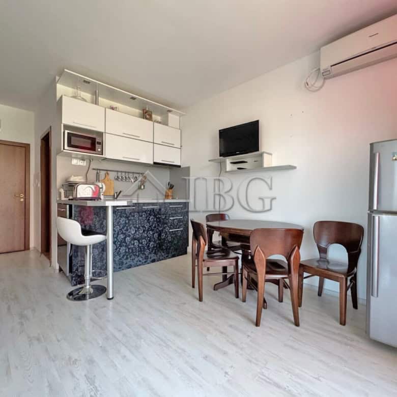 Interior view of a ground-floor two-bedroom apartment in Sunny Beach with modern kitchen and dining.